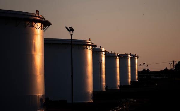 The sun sets behind a crude oil storage facility in Cushing, Oklahoma, on May 4, 2020. The IEA's 31 members plan to release 120 million of barrels of oil from their emergency reserves, half of which will come from the U.S. as part of a previously announce The sun sets behind a crude oil storage facility in Cushing, Oklahoma, on May 4, 2020. The IEA's 31 members plan to release 120 million of barrels of oil from their emergency reserves, half of which will come from the U.S. as part of a previously announce