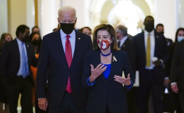President Biden walks with House Speaker Nancy Pelosi on Capitol Hill on Friday after attending a meeting with the House Democratic Caucus to try to resolve an impasse around the bipartisan infrastructure bill. President Biden walks with House Speaker Nancy Pelosi on Capitol Hill on Friday after attending a meeting with the House Democratic Caucus to try to resolve an impasse around the bipartisan infrastructure bill.