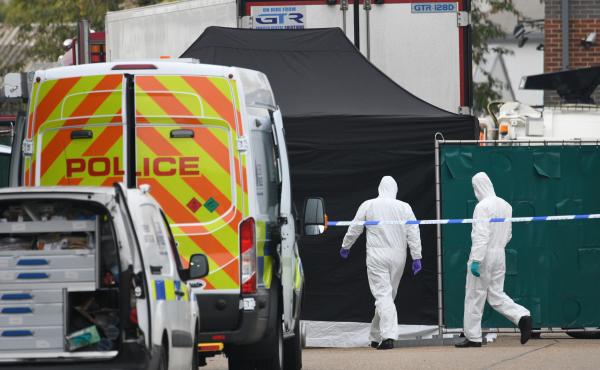 A police forensic investigation team walks near the site where 39 bodies were discovered in the back of a truck on Wednesday in Waterglade Industrial Park in Grays, England. Police believe the truck is from Bulgaria, a member of the European Union, and th A police forensic investigation team walks near the site where 39 bodies were discovered in the back of a truck on Wednesday in Waterglade Industrial Park in Grays, England. Police believe the truck is from Bulgaria, a member of the European Union, and th
