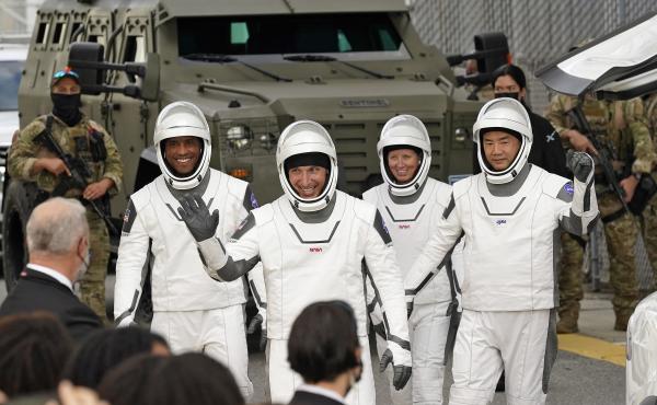 Astronauts (from left) Victor Glover, Michael Hopkins, Shannon Walker and Japan's Soichi Noguchi wave to family and friends as they leave for the launch site on Sunday. Astronauts (from left) Victor Glover, Michael Hopkins, Shannon Walker and Japan's Soichi Noguchi wave to family and friends as they leave for the launch site on Sunday.
