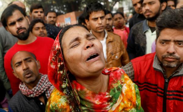 A fire that swept through a factory where laborers were sleeping on Sunday morning, killing at least 43 people. Relatives of the victims gathered outside a hospital mortuary in the city on Sunday. A fire that swept through a factory where laborers were sleeping on Sunday morning, killing at least 43 people. Relatives of the victims gathered outside a hospital mortuary in the city on Sunday.