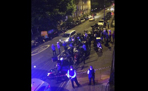 Authorities respond to the scene of an acid attack in London on Thursday night. Authorities respond to the scene of an acid attack in London on Thursday night.