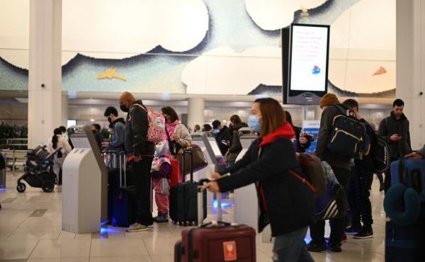 Travelers wear masks at LaGuardia Airport in New York City on Tuesday as concern grows worldwide over omicron, the newest coronavirus variant. Minnesota confirmed the second U.S. omicron case on Thursday, and Colorado the third. Travelers wear masks at LaGuardia Airport in New York City on Tuesday as concern grows worldwide over omicron, the newest coronavirus variant. Minnesota confirmed the second U.S. omicron case on Thursday, and Colorado the third.