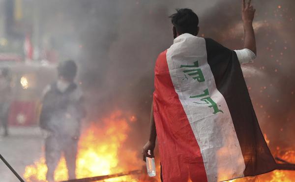 Anti-government protesters set fire and close streets during ongoing protests in Baghdad, Iraq on Saturday. Anti-government protesters set fire and close streets during ongoing protests in Baghdad, Iraq on Saturday.