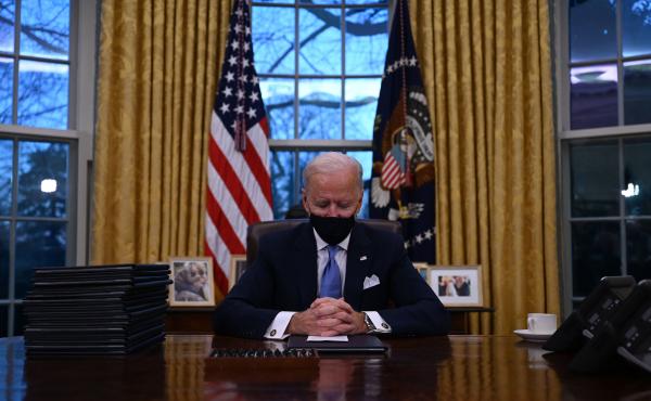 President Biden sits in the Oval Office at the White House after being sworn in as the 46th president of the United States on Wednesday. President Biden sits in the Oval Office at the White House after being sworn in as the 46th president of the United States on Wednesday.