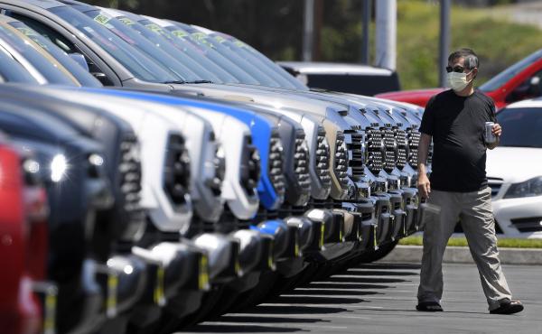 A customer looks at trucks Friday at a Toyota dealership in El Monte, Calif. Car sales have been recovering for several weeks despite the continuing coronavirus outbreak. A customer looks at trucks Friday at a Toyota dealership in El Monte, Calif. Car sales have been recovering for several weeks despite the continuing coronavirus outbreak.
