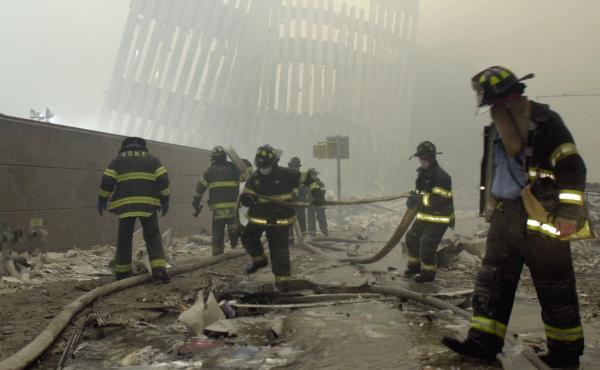 Firefighters work at Ground Zero, the site of the World Trade Center attacks, on Sept. 11, 2001. Firefighters work at Ground Zero, the site of the World Trade Center attacks, on Sept. 11, 2001.