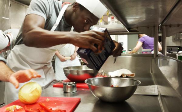 University of Chicago medical student Manny Quaidoo adds a pinch of salt to the spinach feta frittata he's learning to cook as part of a culinary medicine class. University of Chicago medical student Manny Quaidoo adds a pinch of salt to the spinach feta frittata he's learning to cook as part of a culinary medicine class.
