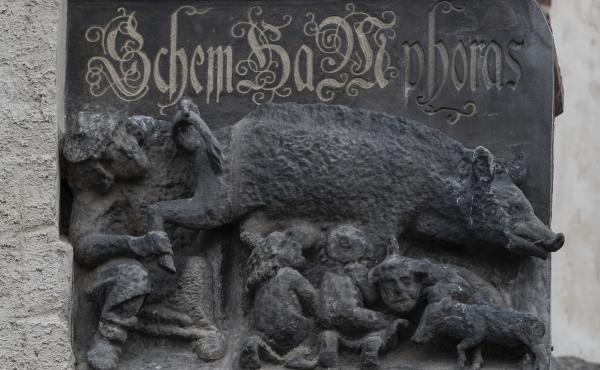 On the facade of the Wittenberg Town Church in Germany, a relief depicting Jews and a large pig is at the heart of controversy and a legal battle. On the facade of the Wittenberg Town Church in Germany, a relief depicting Jews and a large pig is at the heart of controversy and a legal battle.