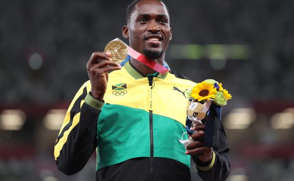 Gold medalist Hansle Parchment of Jamaica holds up his medal on the podium during the medal ceremony for the men's 110-meter hurdles on Aug. 5. Gold medalist Hansle Parchment of Jamaica holds up his medal on the podium during the medal ceremony for the men's 110-meter hurdles on Aug. 5.