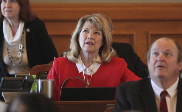 Kansas state Rep. Cheryl Helmer (center), R-Mulvane, watches one of the House's electronic tally board during vote on April 26 at the Statehouse in Topeka, Kan. Helmer has complained publicly about having to share women's restrooms with a transgender coll Kansas state Rep. Cheryl Helmer (center), R-Mulvane, watches one of the House's electronic tally board during vote on April 26 at the Statehouse in Topeka, Kan. Helmer has complained publicly about having to share women's restrooms with a transgender coll