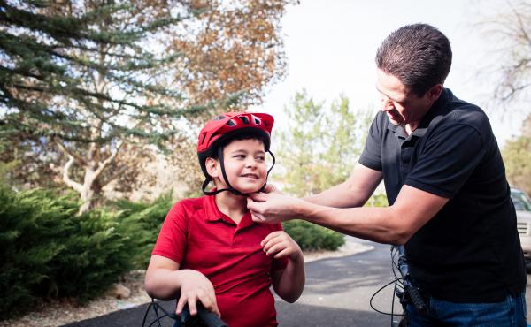 Adam Woodrum and his son, Robert, get ready for a bike ride near their home in Carson City, Nev., this month. During the summer, Robert had a bike accident that resulted in a hefty bill from the family's insurer. Adam Woodrum and his son, Robert, get ready for a bike ride near their home in Carson City, Nev., this month. During the summer, Robert had a bike accident that resulted in a hefty bill from the family's insurer.