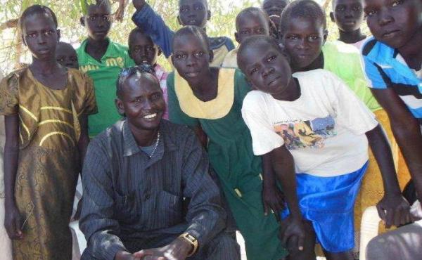 Daniel Majook Gai from South Sudan goes in and out of his war-torn country to help children there go to school. Daniel Majook Gai from South Sudan goes in and out of his war-torn country to help children there go to school.
