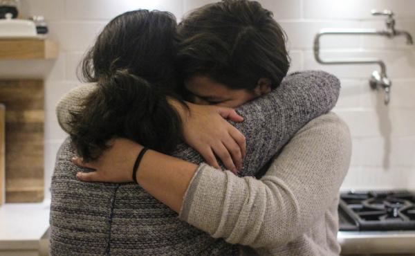 Maria Rivas and her 15-year-old daughter, Emily, embrace after their StoryCorps interview last month. Maria Rivas and her 15-year-old daughter, Emily, embrace after their StoryCorps interview last month.
