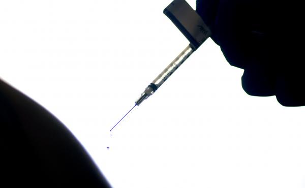 A droplet falls from a syringe after a health care worker was injected with the Pfizer COVID-19 vaccine last year at a hospital in Providence, R.I. A droplet falls from a syringe after a health care worker was injected with the Pfizer COVID-19 vaccine last year at a hospital in Providence, R.I.