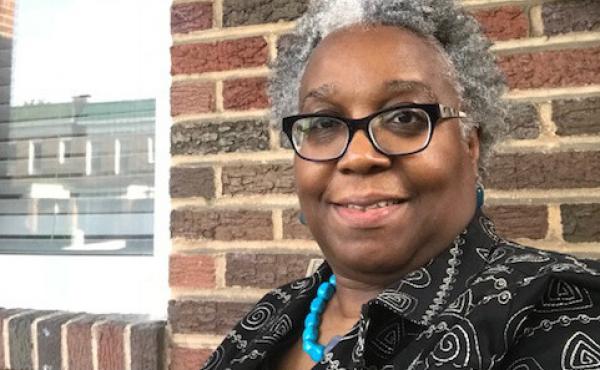 Wanda Onafuwa says a house next door to her in Baltimore fell into disrepair after Bank of America foreclosed on the property. Wanda Onafuwa says a house next door to her in Baltimore fell into disrepair after Bank of America foreclosed on the property.