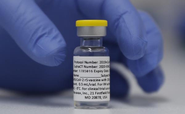 A vial of the experimental Novavax coronavirus vaccine is ready for use in a London study in 2020. Novavax's vaccine candidate contains a noninfectious bit of the virus — the spike protein — with a substance called an adjuvant added that helps the bod A vial of the experimental Novavax coronavirus vaccine is ready for use in a London study in 2020. Novavax's vaccine candidate contains a noninfectious bit of the virus — the spike protein — with a substance called an adjuvant added that helps the bod