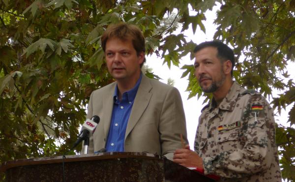 German official Philipp Ackermann gives a speech with military translator Mohamed Oda in 2006, while heading the Provincial Reconstruction Team. German official Philipp Ackermann gives a speech with military translator Mohamed Oda in 2006, while heading the Provincial Reconstruction Team.