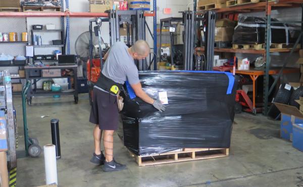 A worker at VKE Cargo in Miami prepares a pallet containing cargo to be shipped to Venezuela. Fewer shipping companies are willing and able to ship to Venezuela. A worker at VKE Cargo in Miami prepares a pallet containing cargo to be shipped to Venezuela. Fewer shipping companies are willing and able to ship to Venezuela.