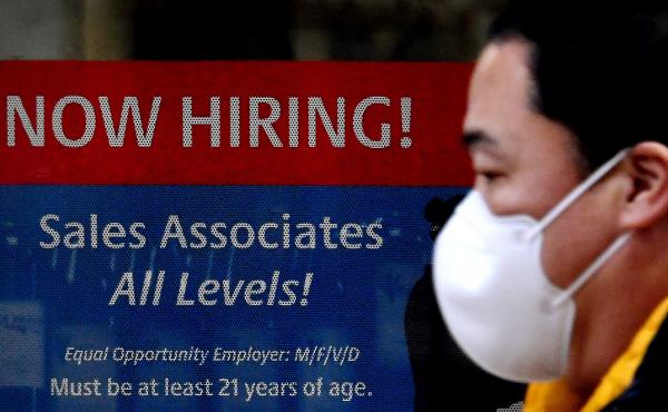A man walks past a "Now Hiring" sign in front of a store in early December in Arlington, Va. U.S. employers added 379,000 jobs in February, as hiring picked up sharply from the previous month. A man walks past a "Now Hiring" sign in front of a store in early December in Arlington, Va. U.S. employers added 379,000 jobs in February, as hiring picked up sharply from the previous month.
