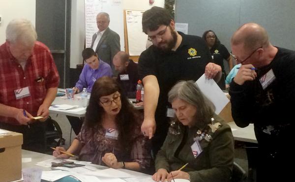 Election officials in Newport News, Va., examine ballots during a recount for a House of Delegates race on Tuesday, Dec. 19, 2017. Election officials in Newport News, Va., examine ballots during a recount for a House of Delegates race on Tuesday, Dec. 19, 2017.