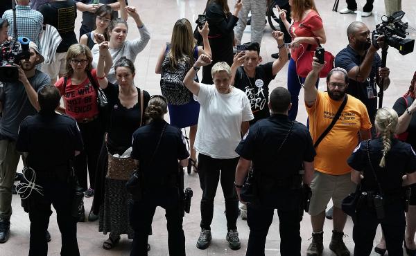 Activists chant during a protest outside the office of Senate Judiciary Committee Chairman Chuck Grassley of Iowa. Activists chant during a protest outside the office of Senate Judiciary Committee Chairman Chuck Grassley of Iowa.