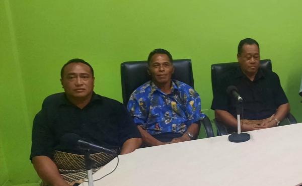 Lisala Folau (wearing blue printed shirt) says he swam for more than 24 hours after getting swept to sea by Saturday's tsunami, sits with other people of Atata island in Nuku'alofa, Tonga, on Wednesday in this picture obtained from social media. Lisala Folau (wearing blue printed shirt) says he swam for more than 24 hours after getting swept to sea by Saturday's tsunami, sits with other people of Atata island in Nuku'alofa, Tonga, on Wednesday in this picture obtained from social media.