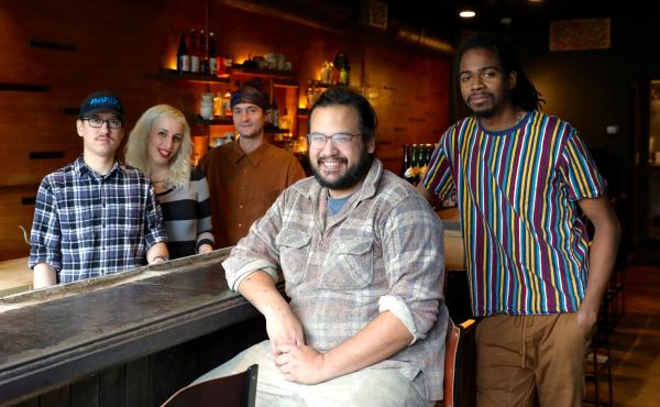 James Mark (center) inside his restaurant Big King, along with cooks (from left) Oscar Lange, Emily Joslyn, Peter Kachmarsky and JC Kuvaszko. Mark employs fewer than 50 people so isn't required to provide health benefits. But it helps with staff retention James Mark (center) inside his restaurant Big King, along with cooks (from left) Oscar Lange, Emily Joslyn, Peter Kachmarsky and JC Kuvaszko. Mark employs fewer than 50 people so isn't required to provide health benefits. But it helps with staff retention