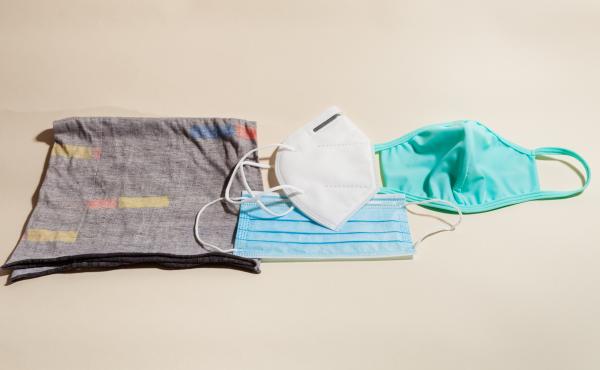 Left to right: a neck gaiter (aka a buff) that slips over the head; a KN95 respirator, a version of the N95 respirator used in U.S. hospitals; a pleated surgical mask (below the KN95); a cloth mask. Left to right: a neck gaiter (aka a buff) that slips over the head; a KN95 respirator, a version of the N95 respirator used in U.S. hospitals; a pleated surgical mask (below the KN95); a cloth mask.