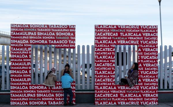 Migrants seeking an asylum appointment with U.S. Customs and Border Protection officers wait at El Chaparral port of entry in Tijuana. Migrants seeking an asylum appointment with U.S. Customs and Border Protection officers wait at El Chaparral port of entry in Tijuana.