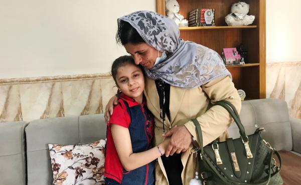 Kamo Zandinan says goodbye in the Mosul orphanage to a 10-year-old girl she believes is her daughter Sonya, taken from her by ISIS six years ago. The girl was rescued by police in March from an Arab family to whom she was not related. Zandinan is waiting Kamo Zandinan says goodbye in the Mosul orphanage to a 10-year-old girl she believes is her daughter Sonya, taken from her by ISIS six years ago. The girl was rescued by police in March from an Arab family to whom she was not related. Zandinan is waiting