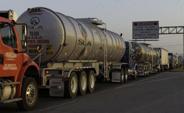 Commercial trucks wait to cross the Pharr-Reynosa International Bridge in Pharr, Texas, last week, before Gov. Greg Abbott lifted his order requiring additional inspections of trucks arriving from Mexico. Commercial trucks wait to cross the Pharr-Reynosa International Bridge in Pharr, Texas, last week, before Gov. Greg Abbott lifted his order requiring additional inspections of trucks arriving from Mexico.