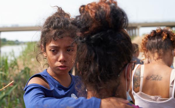 A young migrant cries after illegally crossing the Rio Grande River with her family in Eagle Pass, Texas, on May 22, 2022. A young migrant cries after illegally crossing the Rio Grande River with her family in Eagle Pass, Texas, on May 22, 2022.