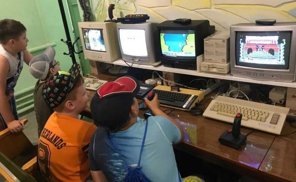 Kids play on retro computers in the IT 8-bit museum in Mariupol, Ukraine, before it was attacked. Kids play on retro computers in the IT 8-bit museum in Mariupol, Ukraine, before it was attacked.