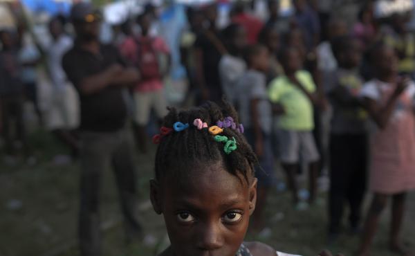 A girl waits with other earthquake victims for the start of a food distribution in Les Cayes, Haiti, in August, a week after a 7.2 magnitude earthquake hit the area. A girl waits with other earthquake victims for the start of a food distribution in Les Cayes, Haiti, in August, a week after a 7.2 magnitude earthquake hit the area.