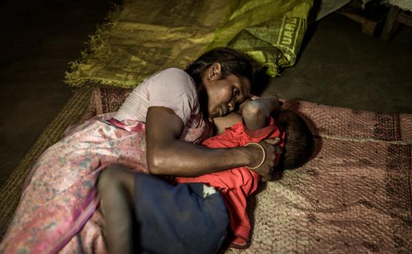 Seteng Horo with her son Abhishek, 4, in their two-room mud hut. Seteng is married to Kunwar. The couple has two children. Their daughter is 6. Seteng Horo with her son Abhishek, 4, in their two-room mud hut. Seteng is married to Kunwar. The couple has two children. Their daughter is 6.