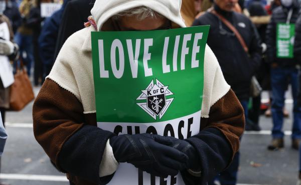 A protester prays ahead of the North Texas March for Life, celebrating the passage and court rulings upholding the Texas law known as Senate Bill 8, on Jan. 15. A protester prays ahead of the North Texas March for Life, celebrating the passage and court rulings upholding the Texas law known as Senate Bill 8, on Jan. 15.