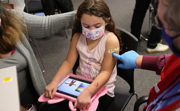 A child receives the Pfizer BioNTech COVID-19 vaccine at the Fairfax County Government Center in Annandale, Va., in November 2021. A committee of advisers to the Food and Drug Administration recommended Wednesday that the agency expand authorization of C A child receives the Pfizer BioNTech COVID-19 vaccine at the Fairfax County Government Center in Annandale, Va., in November 2021. A committee of advisers to the Food and Drug Administration recommended Wednesday that the agency expand authorization of C