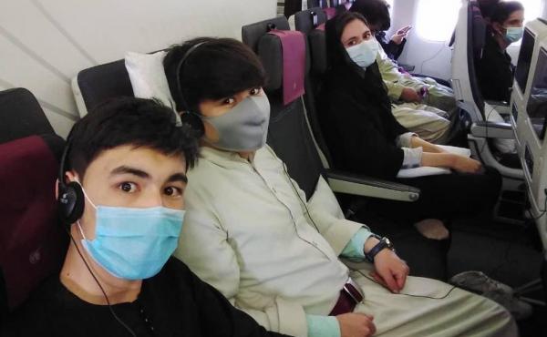 Members of the Afghanistan National Institute of Music on the plane to Doha. Members of the Afghanistan National Institute of Music on the plane to Doha.