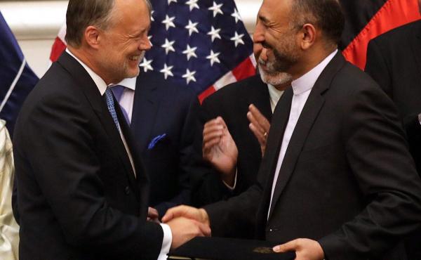 Afghan National Security Adviser Mohammad Hanif Atmar (right) and U.S. Ambassador to Afghanistan James Cunningham exchange documents after signing the Bilateral Security Agreement, with Afghan President Ashraf Ghani (rear, left) and Chief Executive Abdull Afghan National Security Adviser Mohammad Hanif Atmar (right) and U.S. Ambassador to Afghanistan James Cunningham exchange documents after signing the Bilateral Security Agreement, with Afghan President Ashraf Ghani (rear, left) and Chief Executive Abdull