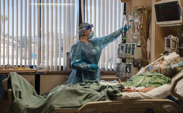 A nurse tends to a Covid-19 patient in the intensive care unit at Providence St. Mary Medical Center in Apple Valley, Calif., on Jan. 11. A nurse tends to a Covid-19 patient in the intensive care unit at Providence St. Mary Medical Center in Apple Valley, Calif., on Jan. 11.