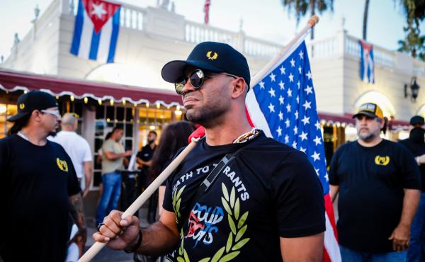 Henry "Enrique" Tarrio, leader of the Proud Boys, holds a U.S. flag during a July protest in Miami as part of a show of solidarity for Cubans who were demonstrating against their government in Cuba. Henry "Enrique" Tarrio, leader of the Proud Boys, holds a U.S. flag during a July protest in Miami as part of a show of solidarity for Cubans who were demonstrating against their government in Cuba.