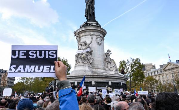 Demonstrators like the one shown here carried "I am Samuel" signs as they gathered on Place de la République in Paris on Sunday to pay tribute to slain history teacher Samuel Paty. Similar gatherings took place in several other cities as France reels fro Demonstrators like the one shown here carried "I am Samuel" signs as they gathered on Place de la République in Paris on Sunday to pay tribute to slain history teacher Samuel Paty. Similar gatherings took place in several other cities as France reels fro