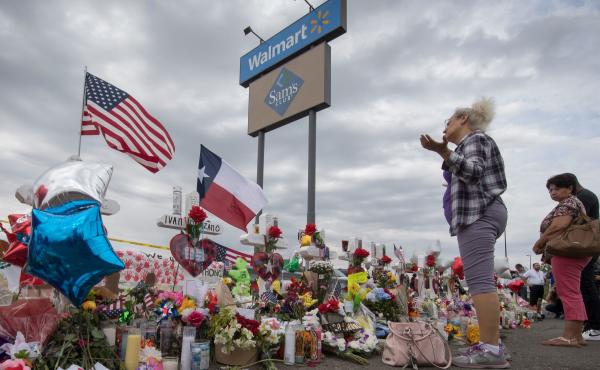 A woman prays at a makeshift memorial for shooting victims at the Cielo Vista Mall Walmart, in El Paso, Texas. A woman prays at a makeshift memorial for shooting victims at the Cielo Vista Mall Walmart, in El Paso, Texas.