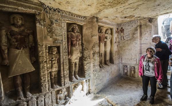Visitors enter a newly-discovered Egyptian tomb at the Saqqara necropolis on Saturday. Visitors enter a newly-discovered Egyptian tomb at the Saqqara necropolis on Saturday.