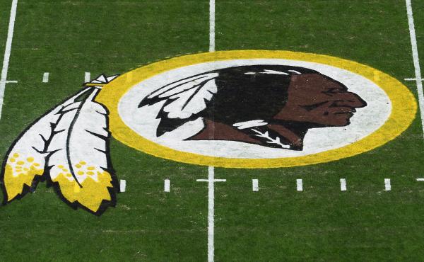 The Washington Redskins' logo is seen before a game in 2019 in Landover, Md. The Redskins have announced the team will be dropping its moniker, which is widely considered a slur against Native Americans. The Washington Redskins' logo is seen before a game in 2019 in Landover, Md. The Redskins have announced the team will be dropping its moniker, which is widely considered a slur against Native Americans.