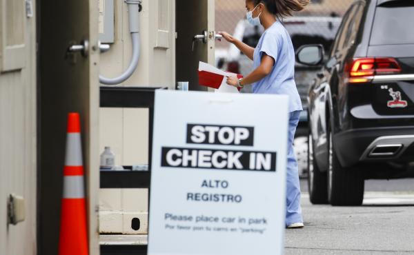 Six states have an agreement to acquire fast-result antigen tests for the coronavirus. Here, a medical worker collects a sample after a patient self-administers a nasal swab test. Six states have an agreement to acquire fast-result antigen tests for the coronavirus. Here, a medical worker collects a sample after a patient self-administers a nasal swab test.