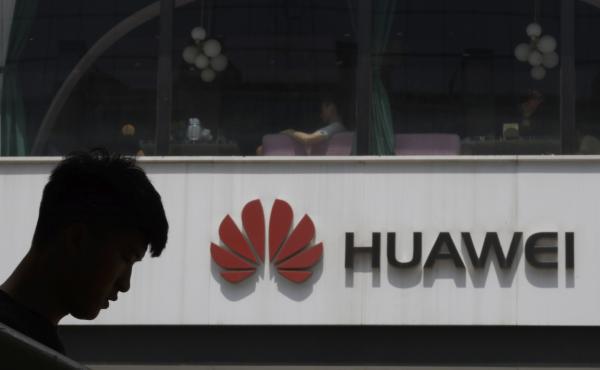 A Chinese man is silhouetted near the Huawei logo in Beijing on Thursday. The Trump administration issued an executive order Wednesday apparently aimed at banning Huawei equipment from U.S. networks. A Chinese man is silhouetted near the Huawei logo in Beijing on Thursday. The Trump administration issued an executive order Wednesday apparently aimed at banning Huawei equipment from U.S. networks.