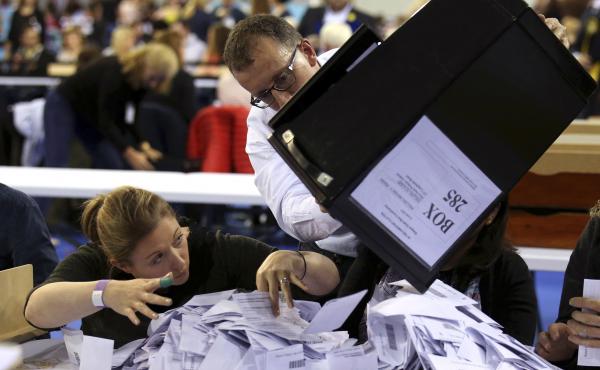 Ballot boxes are emptied to be counted for the general election in Glasgow, Scotland. Ballot boxes are emptied to be counted for the general election in Glasgow, Scotland.