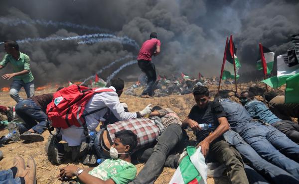 Palestinians set tires on fire, as Israeli soldiers attempt to prevent protesters from breaking through the Gaza-Israel border. The demonstration marked the 70th anniversary of Nakba, or catastrophe, a commemoration of the displacement of hundreds of thou Palestinians set tires on fire, as Israeli soldiers attempt to prevent protesters from breaking through the Gaza-Israel border. The demonstration marked the 70th anniversary of Nakba, or catastrophe, a commemoration of the displacement of hundreds of thou